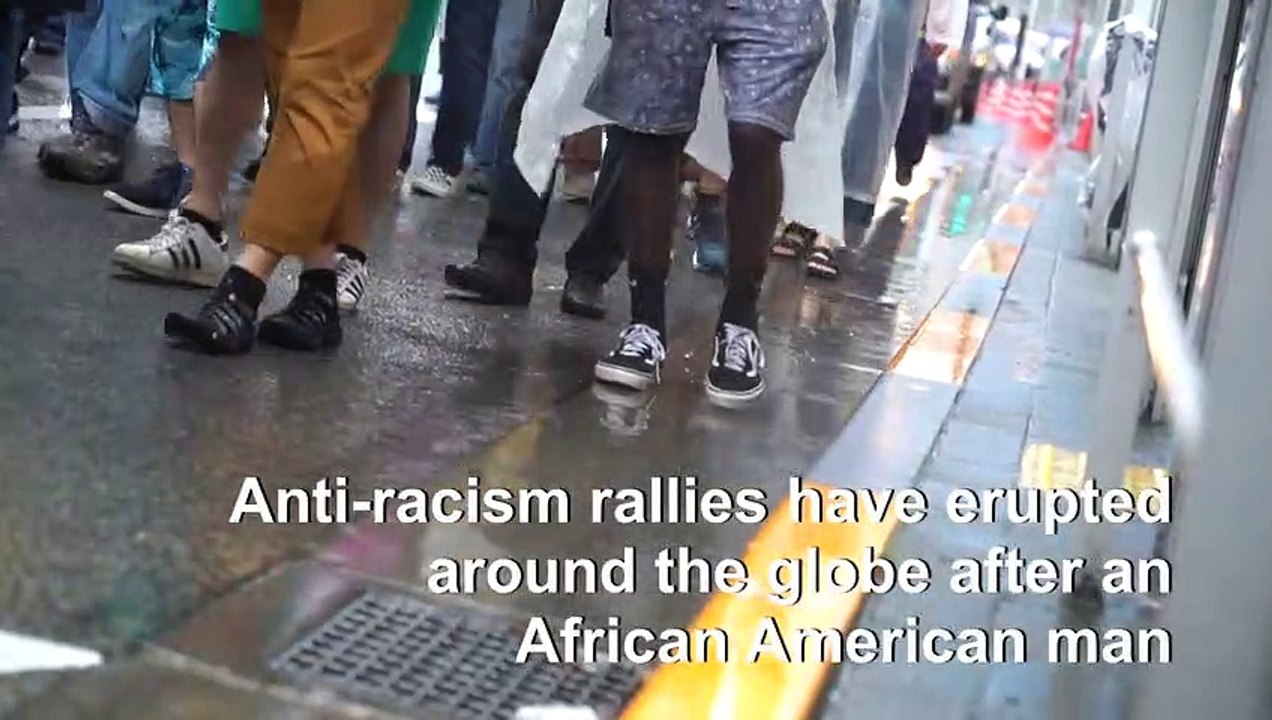 Black Lives Matter supporters brave the rain in Tokyo
