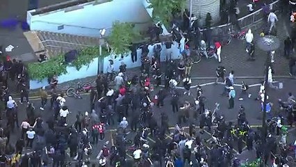 Protesters and police collide as curfew starts