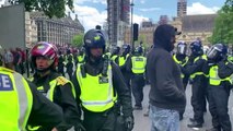 Right-wing and anti-racism protesters scuffle in Britain