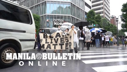 Black Lives Matter supporters brave the rain in Tokyo