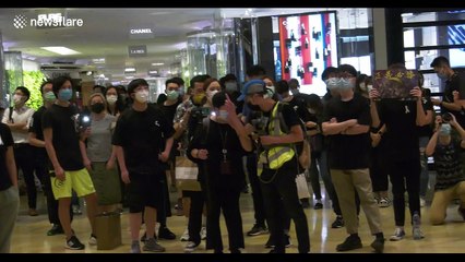 Hong Kong protesters strike defiant tone for 'yellow raincoat man' memorial