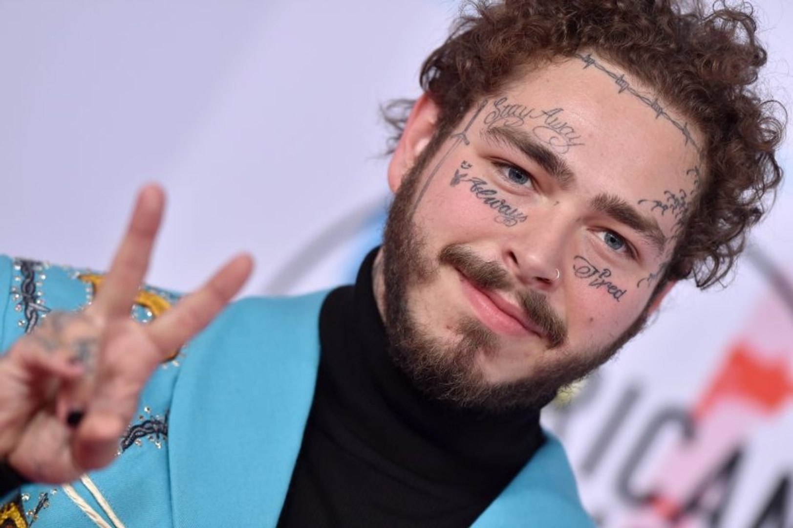 ⁣Post Malone revealed a dramatic new tattoo with his summer haircut