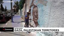 شاهد: فنان فلسطيني في غزة يرسم لوحة جدارية للأمريكي جورج فلويد