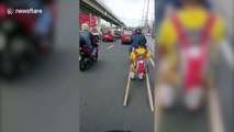 Filipino brothers use wooden sleigh to dodge COVID-19 pillion passenger ban