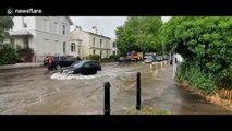 Flash floods cause traffic jams in Cheltenham, South West England