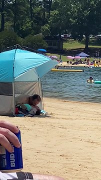 Couple Completely Unconcerned with Other Beach Goers