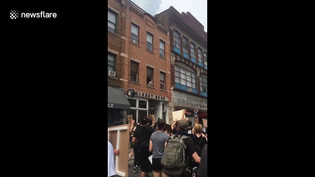 'This pup barks for change!' Dog supports Black Lives Matter with sign