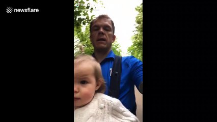 Adorable UK baby tries to say 'cucumber' while walking with dad