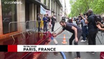 Extinction Rebellion sprays Medef employers' association HQ in Paris with fake blood