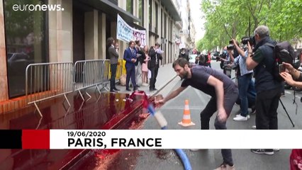Extinction Rebellion sprays Medef employers' association HQ in Paris with fake blood