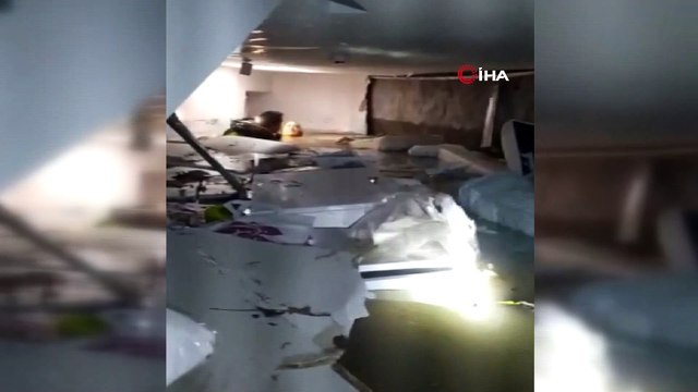 Su basan mağazanın bodrumundaki kadını dalgıç polis kurtardı