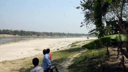 Fish farming on dry riverbed in Bangladesh