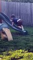 Kid Tries Climbing up Wet Slide