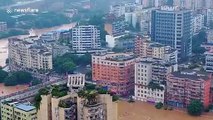 Record-breaking flood submerges cars and buildings in southern China