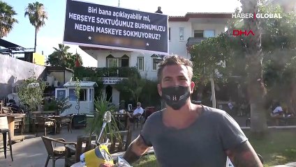 Kafe önünde dikkat çeken pankart: Her şeye soktuğumuz burnumuzu neden maskeye sokmuyoruz
