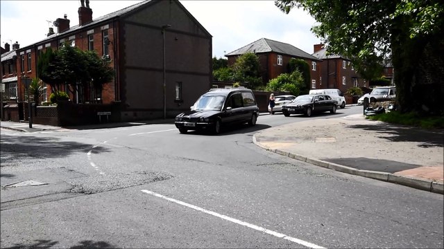People line the streets to say farewell to Des Seabrook as the funeral cortege passes Lodge Road, Orrell.