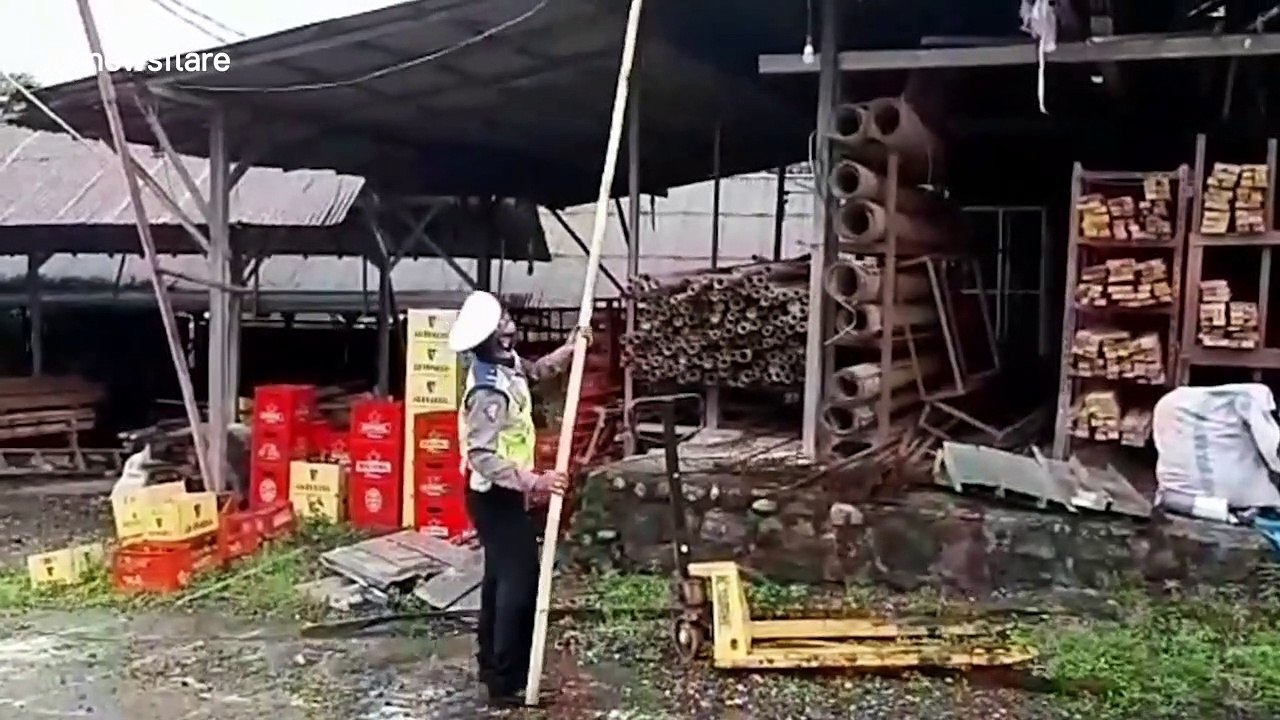 Police retrieve kite stuck on top of building in Bali amid safety warnings about flying them