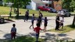 US police officers join kids' football game after someone reported them for 'playing outside'