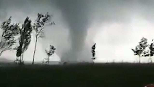 Large waterspout churns through lake