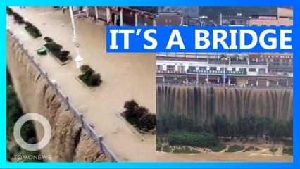 Spectacular Floodwater Cascade Turns Bridge into Dystopian Waterfall 🌊