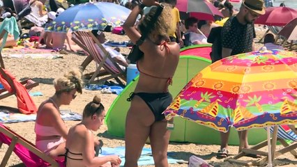 Thousands crowd English beach town as heatwave hits restriction-weary Europe