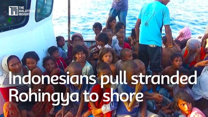 Indonesians pull stranded Rohingya to shore