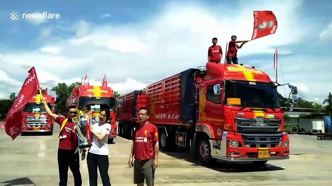 Liverpool fans in Thailand celebrate title victory with parade in red trucks