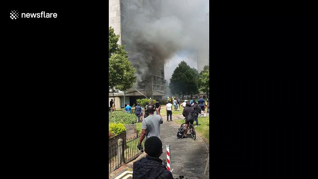 London tower block billows smoke as fire engulfs flat