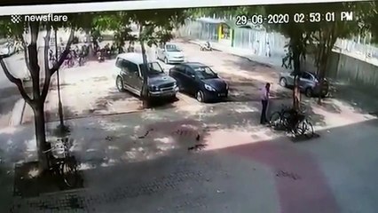 Pillar stops car crashing into shopfront in northern India