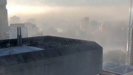 Fog fills the air around skyline