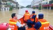 Chinese firefighters rescue residents trapped in flooded buildings after rainstorm