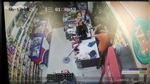Shop assistant in China smashes six beer bottles on knife-wielding robber's head to subdue him