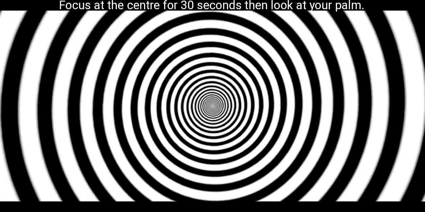 Focus at the centre for 30 seconds then look at your palm.