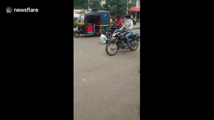 Two men drink in middle of road to overcome Corona worries
