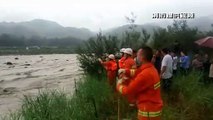Firefighters in southern China rescue passengers after their car became trapped in flooded river
