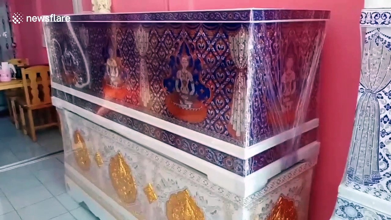 Thai coffin shop decorates caskets as pink home