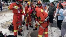 Firefighters rescue woman trapped in deep manhole in China