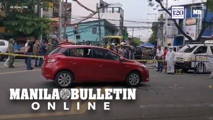 SOCO inspects the bullet-riddled sedan after an ambush along Quirino Highway