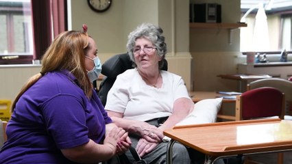 Home worker receives an award after she saved the life of one of her residents' wives