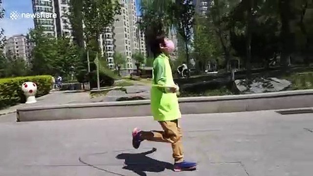 Chinese boy shows off impressive soccer skills by juggling football while skipping
