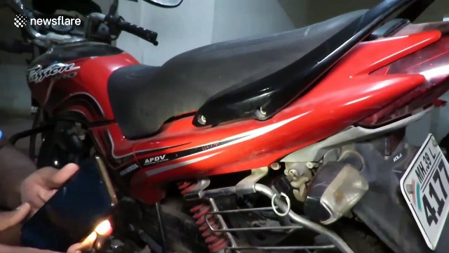 Hissing cobra found hiding inside motorbike in western India