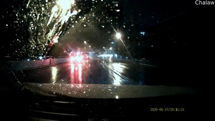 Power Wires Envelop Transport Truck on a Rainy Evening