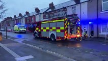 Fire crews and ambulance service vehicles on the scene of house fire in Sheriff Street