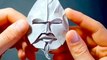 This artist folds intricate origami faces with paper