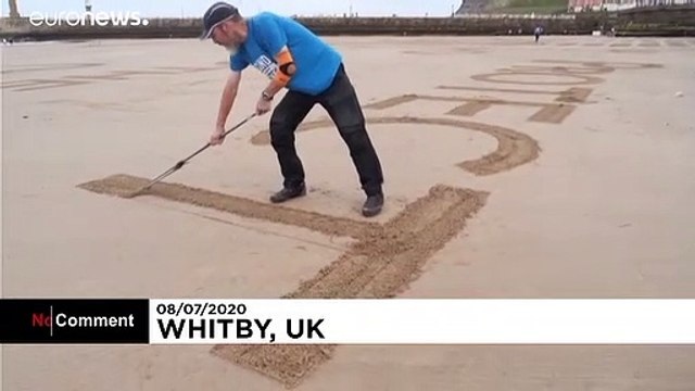 Dessins géants de sable contre le covid-19