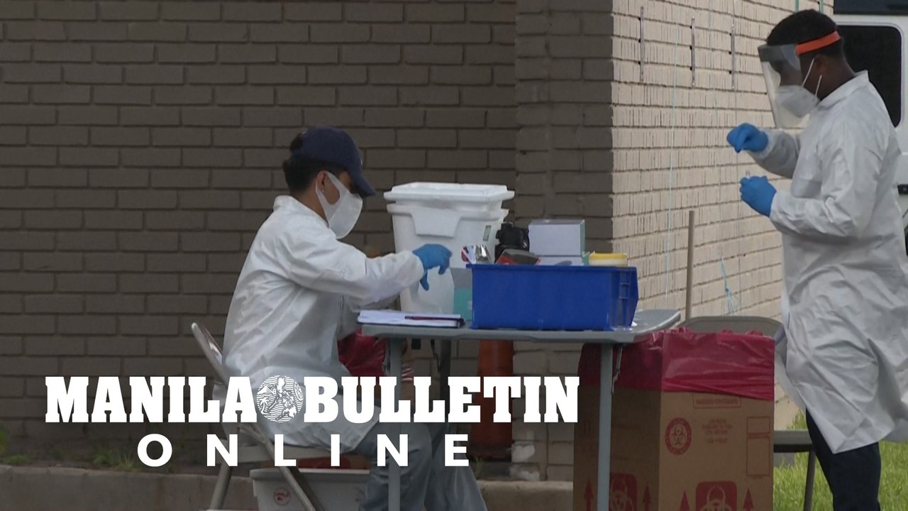 Houston: cars line up at drive-through coronavirus testing site