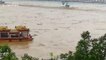 Chinese pleasure boat collapses after crashing into bridge pier during massive flooding