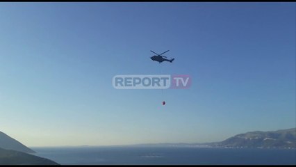 Report TV -Zjarr i madh në zonën e Pashalimanit, helikopteri i FA ndërhyn për shuarjen e flakëve