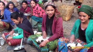 indigenous people eating in group communal eating village food