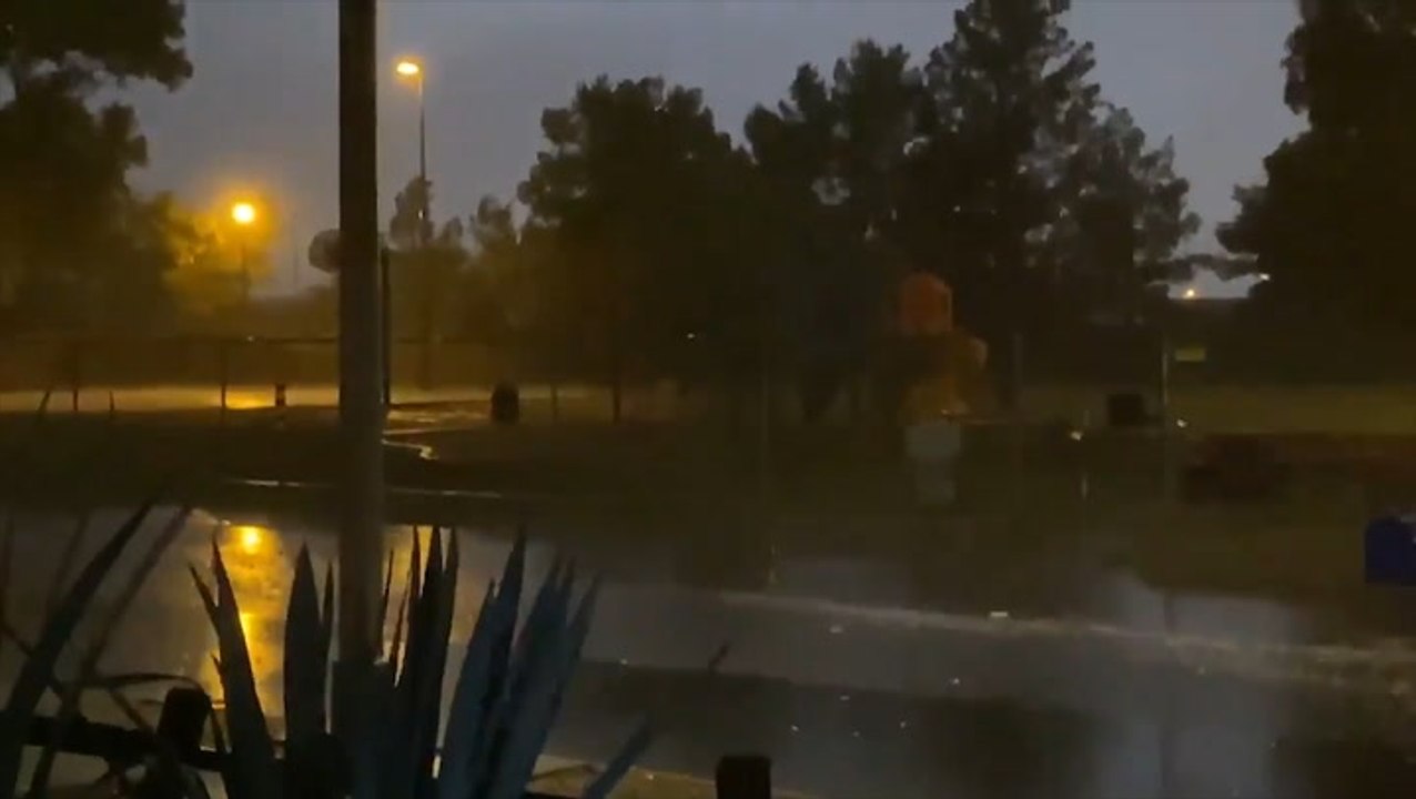 Downpour drenches deserted street